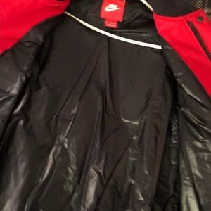 Red black Men’s Nike jacket. Like new worn only 3x